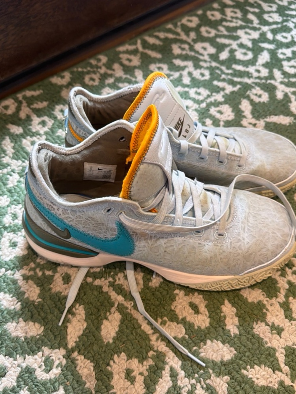 Nike Light Gray Sneakers with Teal Swoosh and Yellow Tongue